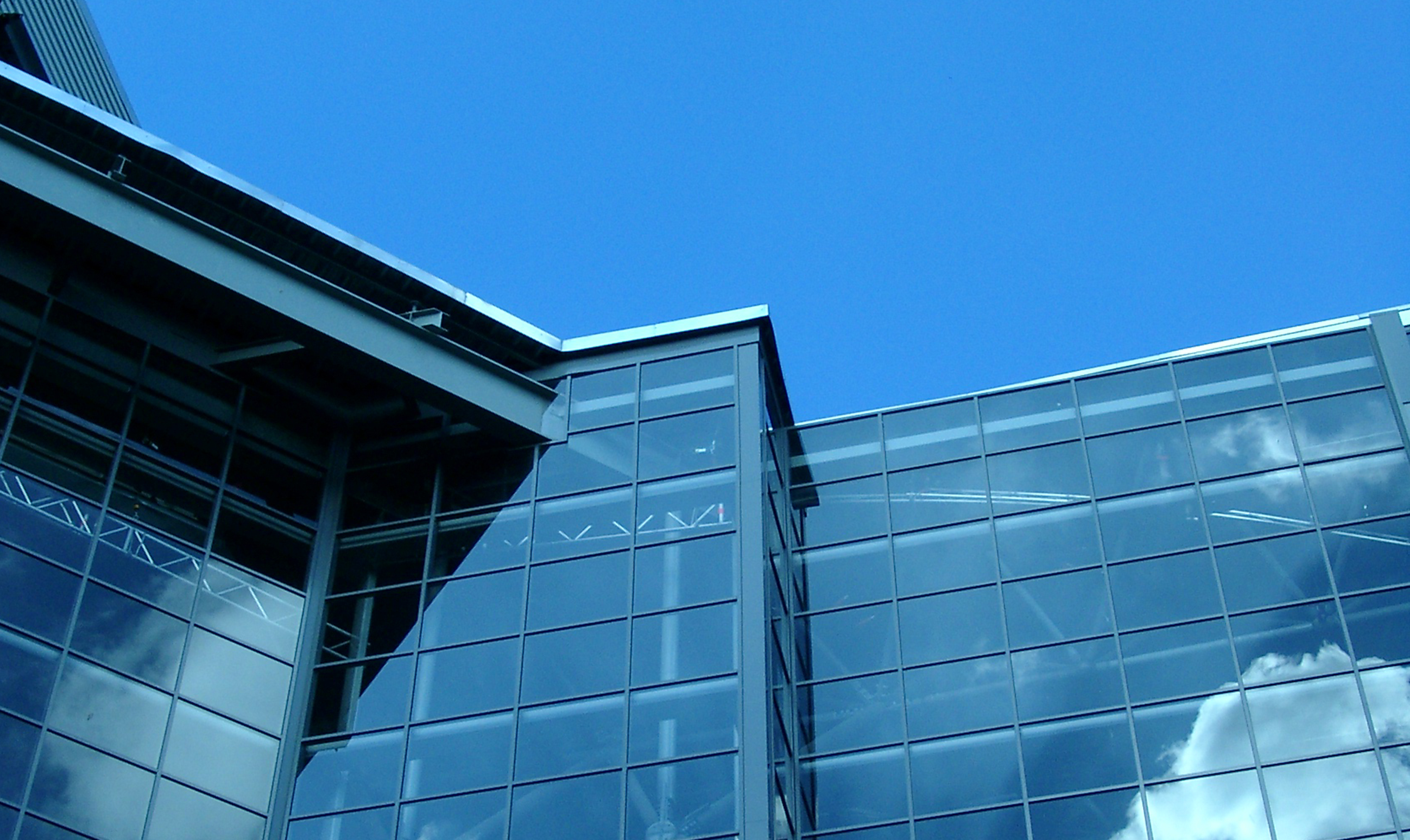 Blue corporate buildings against blue sky