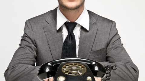 Telephone and man with business suit